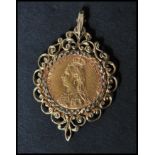 A 19th century Victorian sovereign pendant with Queen Victoria facing left set to a hallmarked 9ct