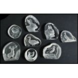 A collection of twelve glass lead crystal paperweights to include examples of birds, deer, fox, Hare