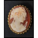 A hallmarked 9ct gold shell cameo brooch with maiden facing left with pin to verso. Weighs 6.7