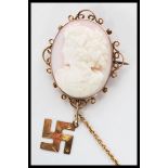 A 19th century Victorian pink conch shell carved cameo brooch depicting a maiden facing left with