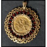 An early 20th century George V 1912 half sovereign gold pendant. The sovereign set to a fantastic