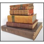 A collection of Antique Georgian and Victorian 19th century mainly leather bound books to include
