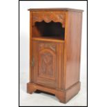 An Edwardian mahogany pedestal pot cupboard raised