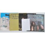 A collection of four long play Lp vinyl records by