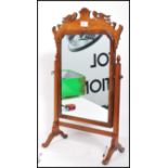 A Victorian walnut dressing table mirror of good quality, the mirror of pier form with splayed leg