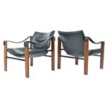 A pair of mid 20th Century Maurice Burke Arkana safari chairs / arm,chairs. Each with faux black