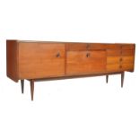 An exceptional mid century Younger's teak wood sideboard having turned and tapering angular legs