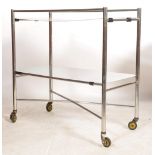 A good original mid century Industrial surgeons theatre trolley of tubular metal and stainless steel