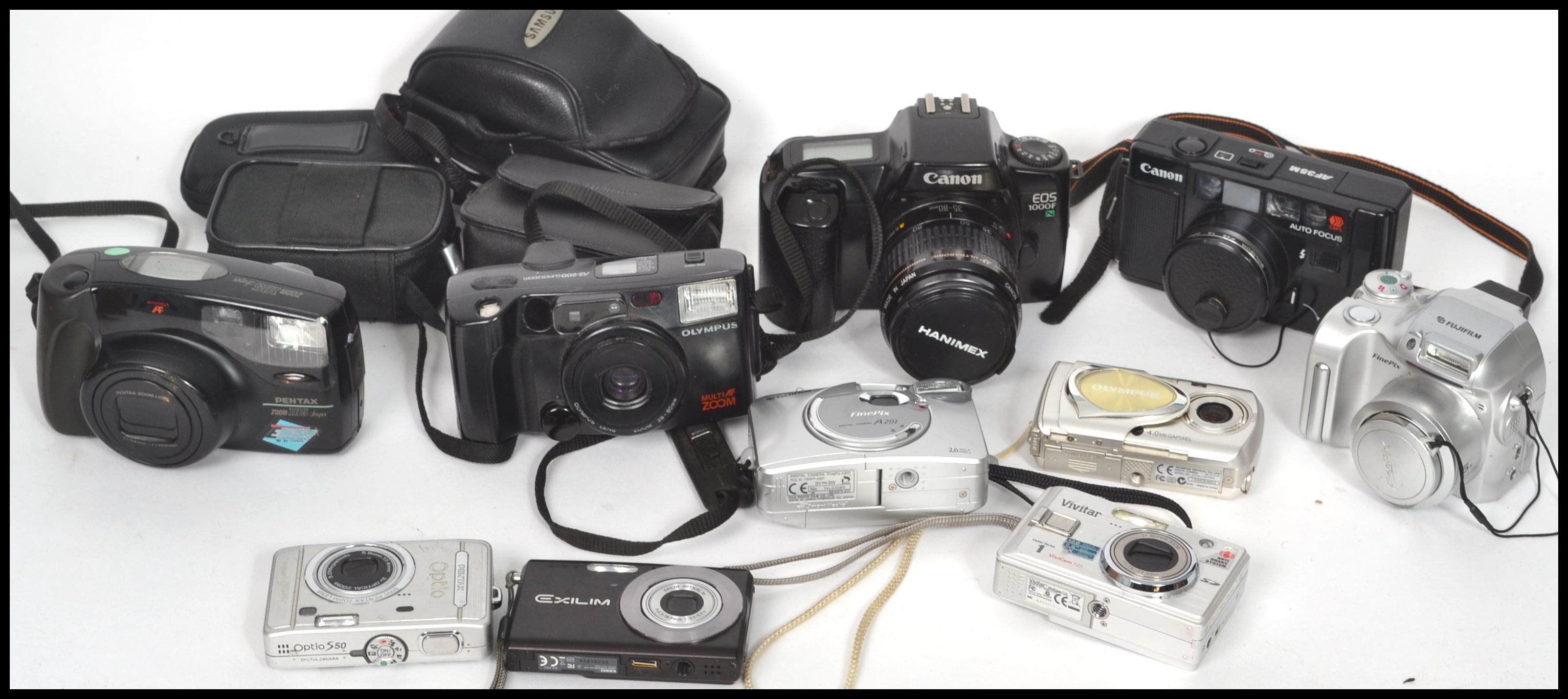 A collection of vintage 20th century  and retro cameras to include Canon EOS, Casio, Fuji, Kodak,