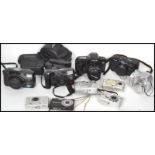 A collection of vintage 20th century  and retro cameras to include Canon EOS, Casio, Fuji, Kodak,