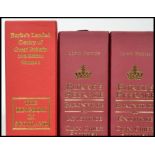 Three Volumes of Burkes Peerage, Baronetage and Knightage 107th Edition with the folder .stand