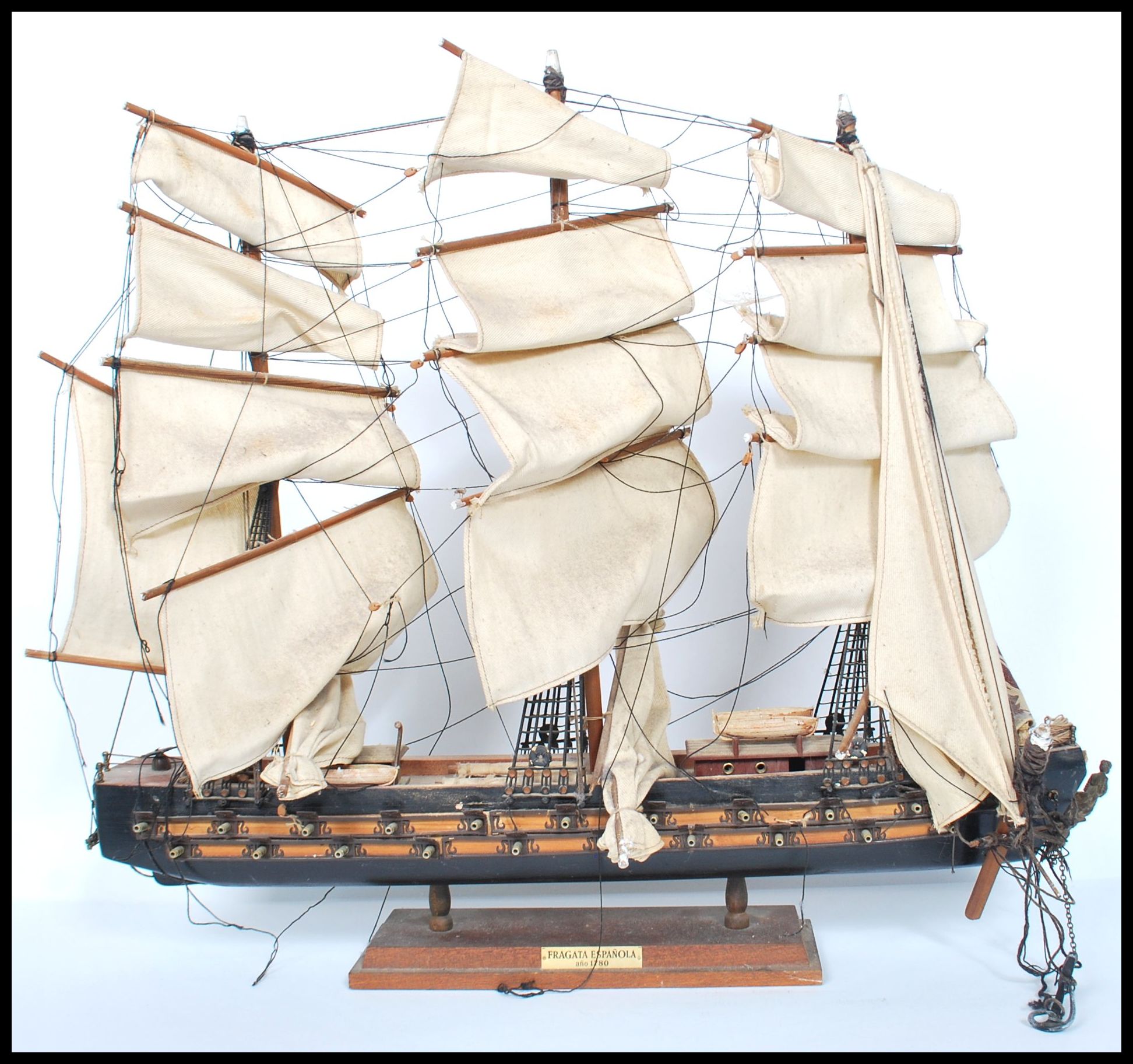 A vintage 20th century  scratch built model of a three masted galleon with sails and rigging. Raised