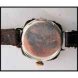 A vintage early 20th century Rolex 1917 trench military interest watch having a silvered dial Arabic