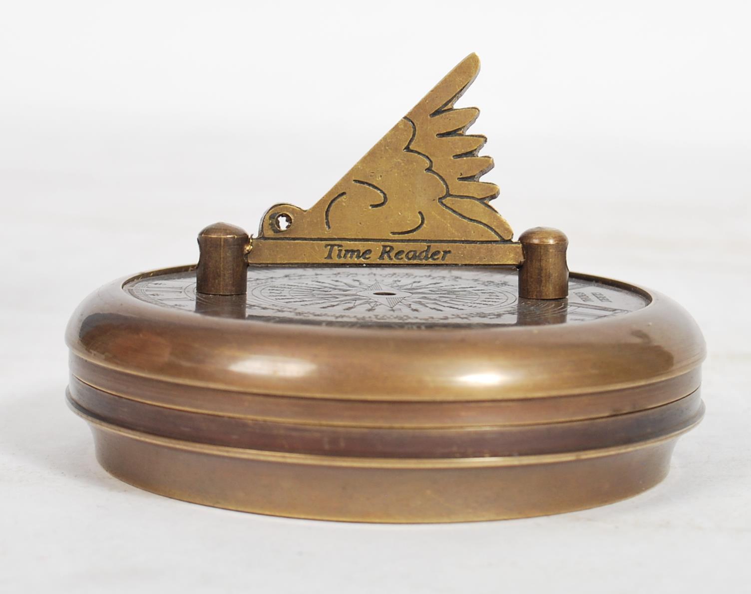 An unusual 20th century Gilbert Sundial - brass pocked cased sundial and compass being of roundel