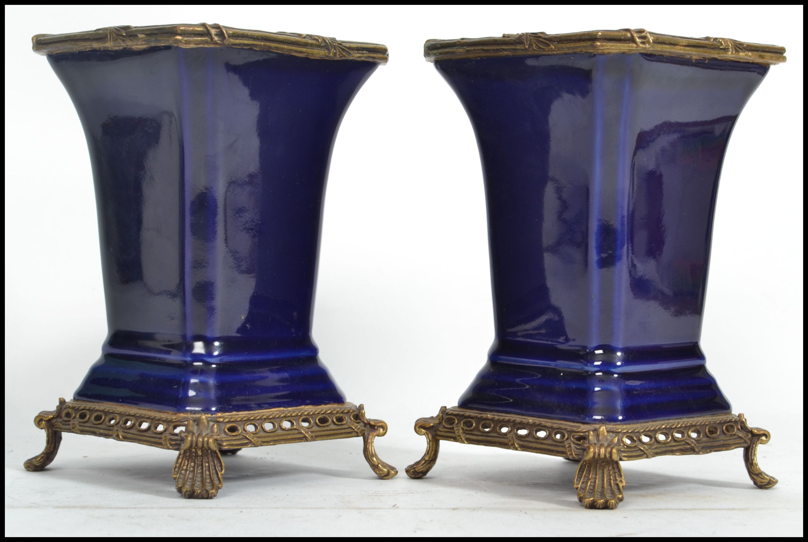 A pair of 19th century ceramic vases of square form having a deep cobalt blue ground with gilt