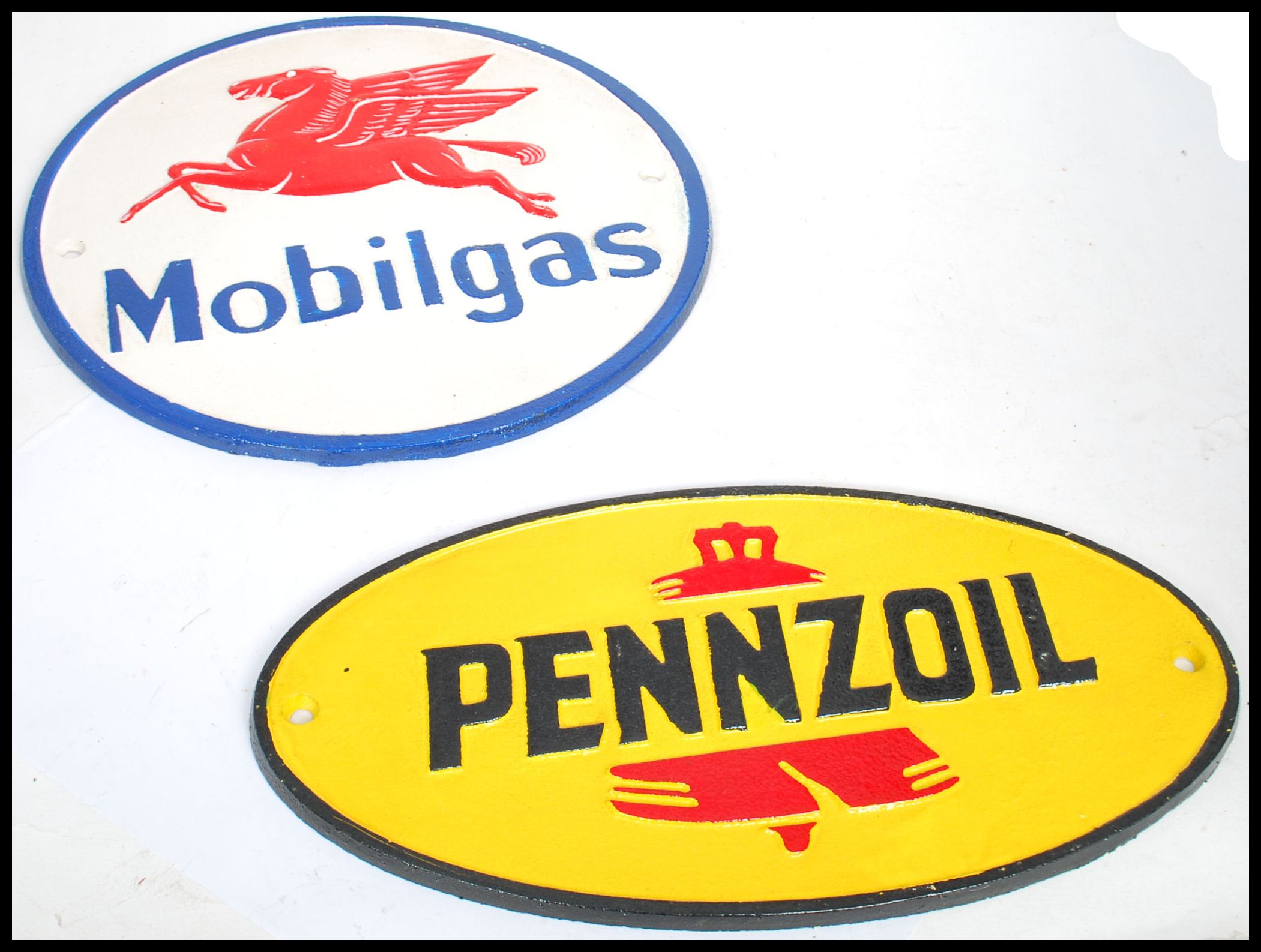 A pair of vintage style cast metal point of sale advertising garage wall plaques for Mobilgas and