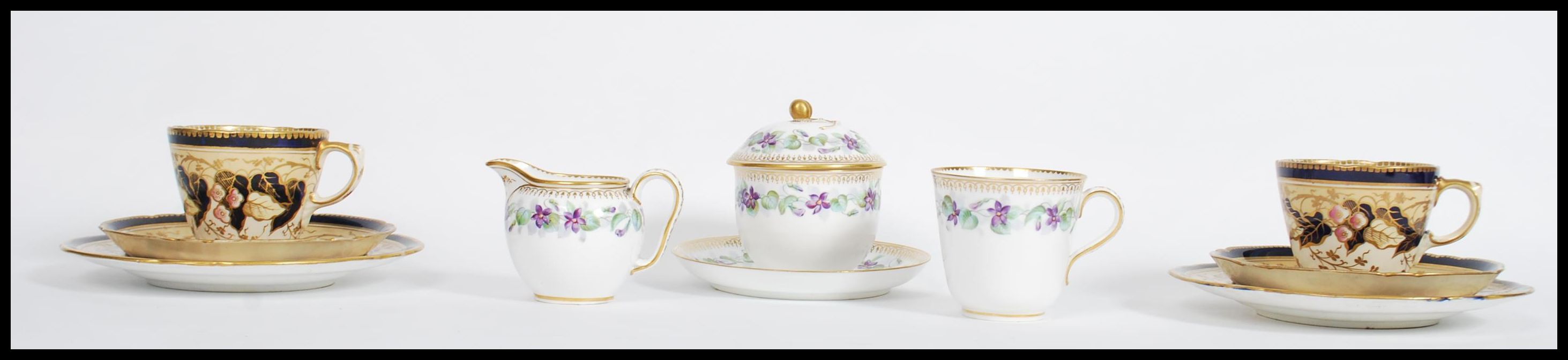 A 19th century Victorian Worcester cup saucer, lidded sugar bowl and creamer milk jug in a