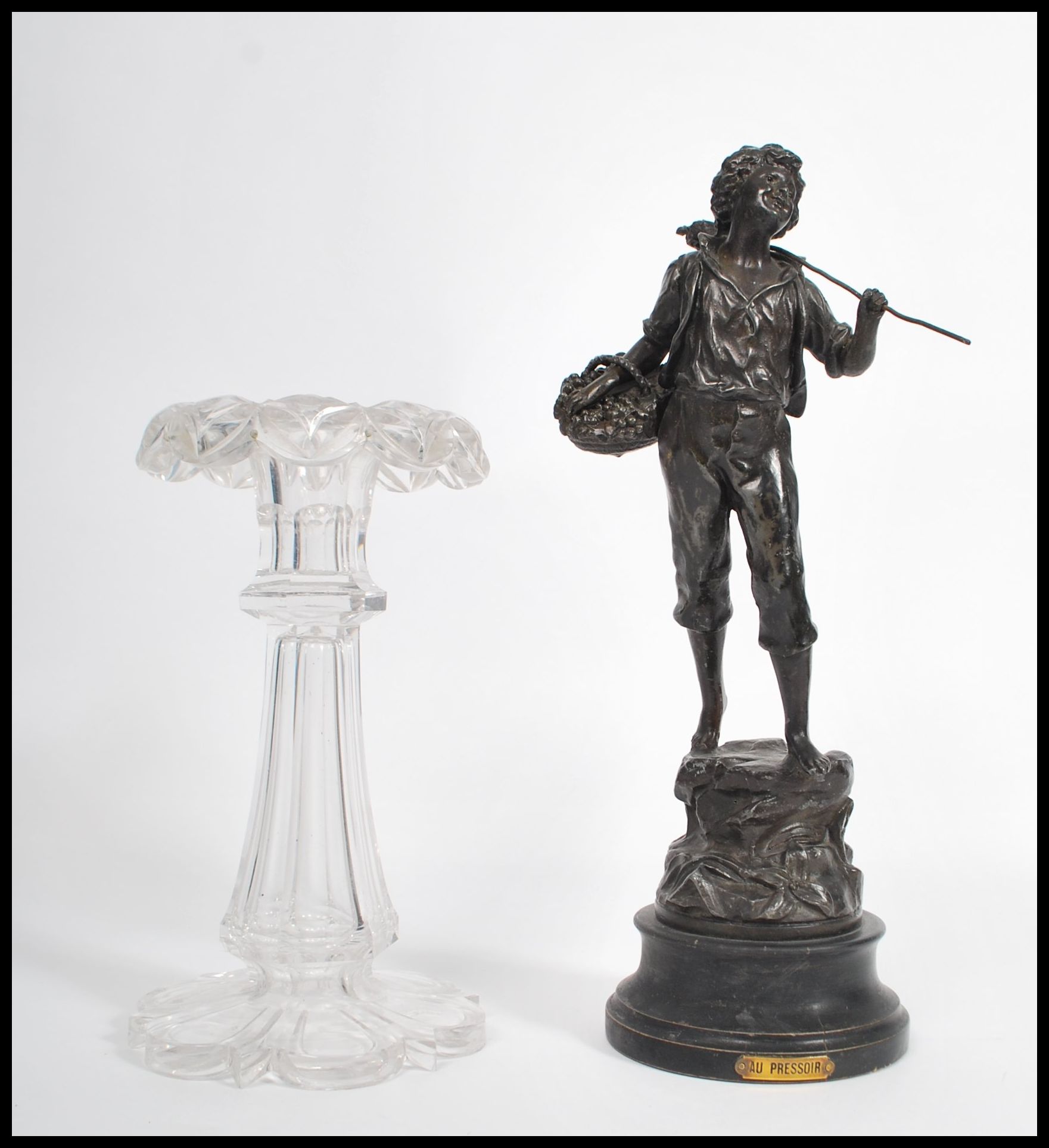 A 19th century cut glass table Lustre centre piece together with a spelter figure raised on a