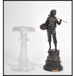 A 19th century cut glass table Lustre centre piece together with a spelter figure raised on a