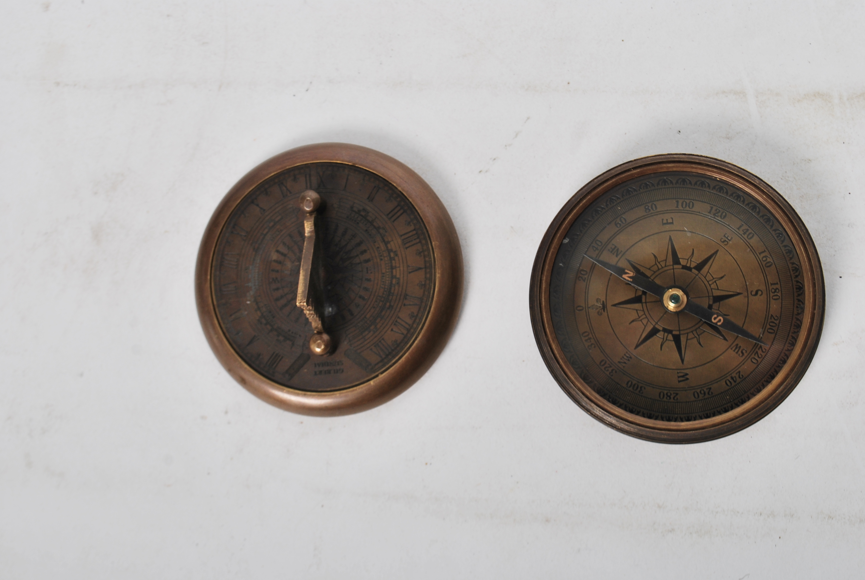 An unusual 20th century Gilbert Sundial - brass pocked cased sundial and compass being of roundel - Image 5 of 5