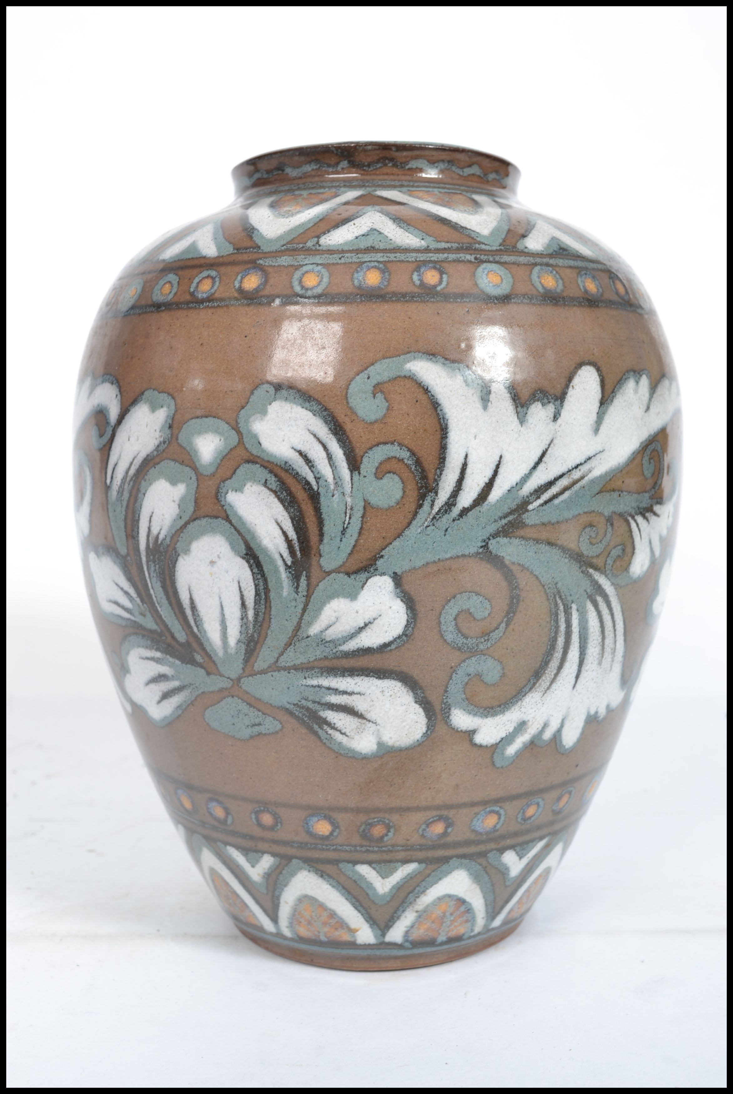 An Oriental Chinese / Japanese stoneware vase having hand painted foliage with character stamp to