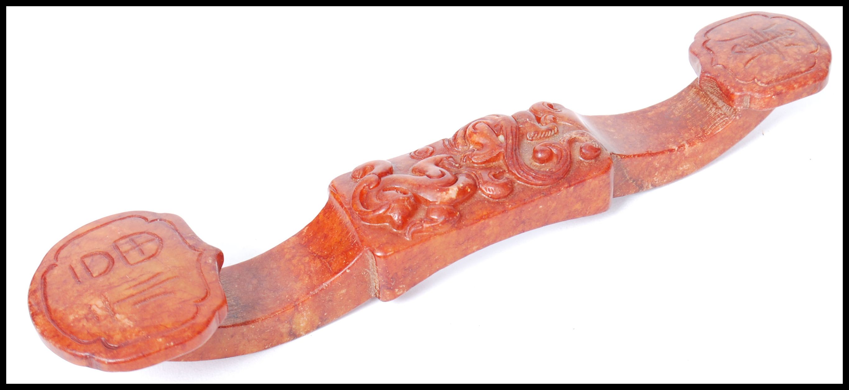 An Oriental Chinese soapstone carved ruyi sceptre. Carved in relief with shou characters and