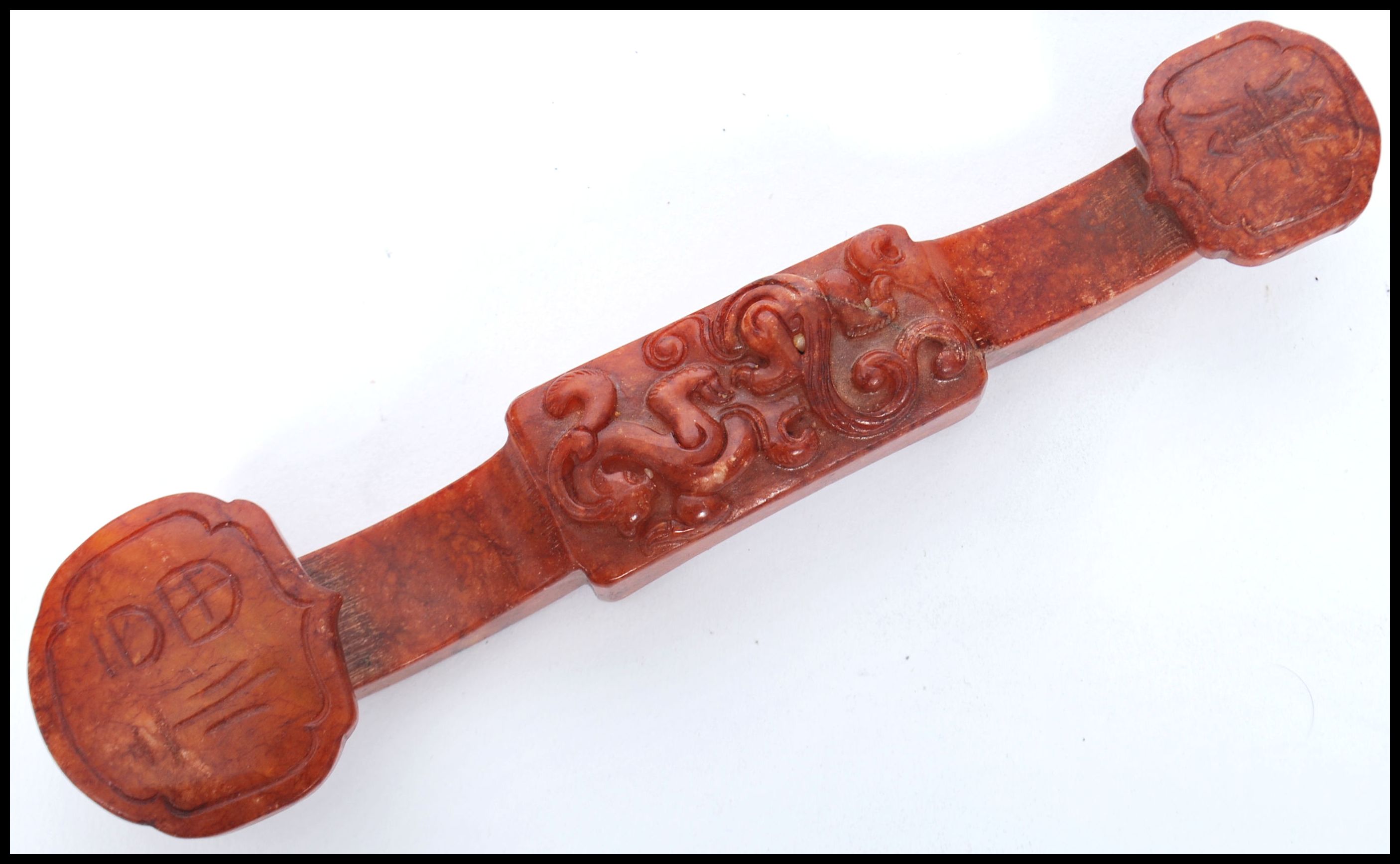 An Oriental Chinese soapstone carved ruyi sceptre. Carved in relief with shou characters and - Image 2 of 3