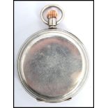 A silver plated Swiss made lever open faced crown wind pocket watch, having enamel face with Roman