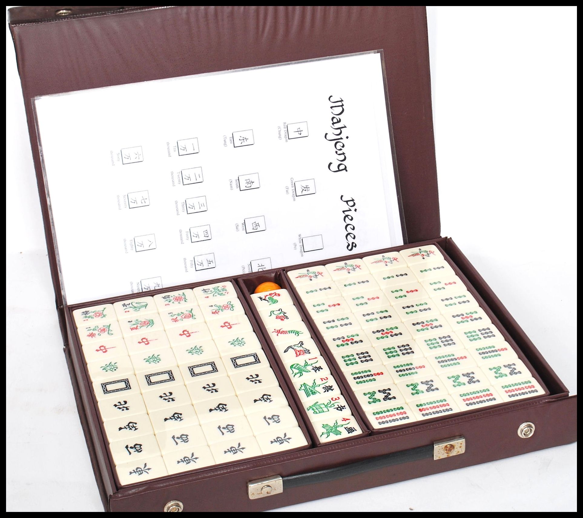 A vintage 20th century Chinese Oriental Mahjong set having ceramic pieces contained within a