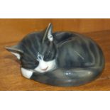 A Royal Copenhagen porcelain model of a curled up sleeping cat, no.422, 8cm high.