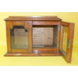 A late-Victorian small mahogany table-top specimen cabinet fitted with a pair of glazed doors and