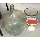 A clear glass carboy, 50cm, an oak oval-framed mirror, various ceramics and miscellaneous items.