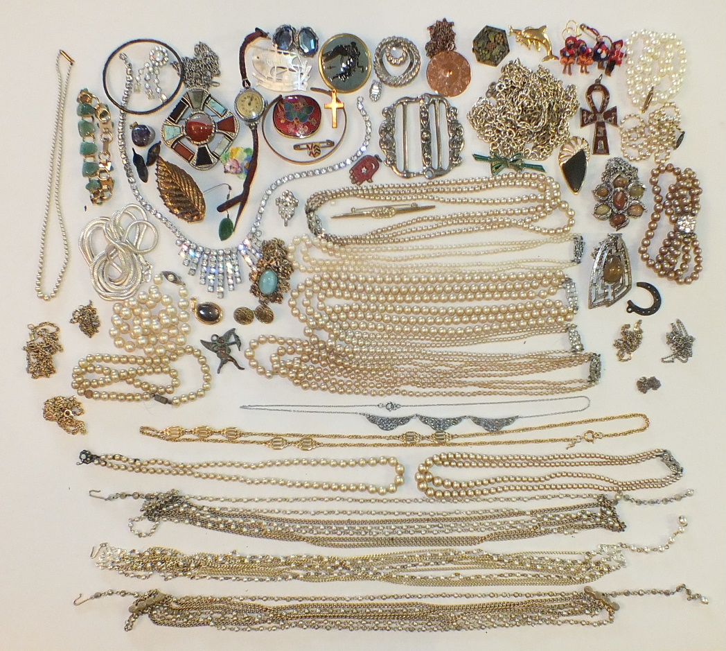 A large quantity of simulated pearls and other costume jewellery, watches, compacts, etc.