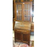 A 20th century oak dresser and an oak bureau bookcase, (2).