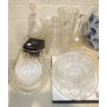 A collection of four cut glass decanters with stoppers, various cut glass bowls, a vase and other