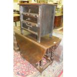 An oak low three-drawer chest, 60cm wide, 60cm high and an oak drop-leaf table on barley-twist