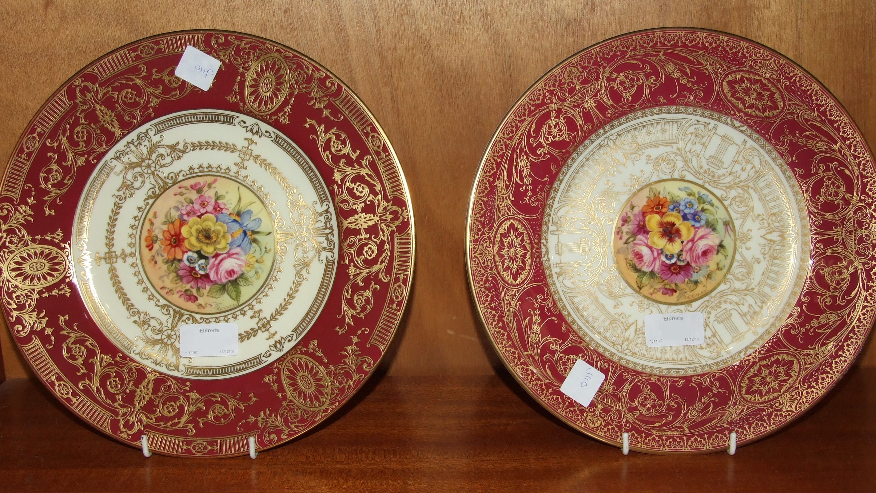 A Royal Worcester cabinet plate by John Freeman painted with circular central panel of flowers