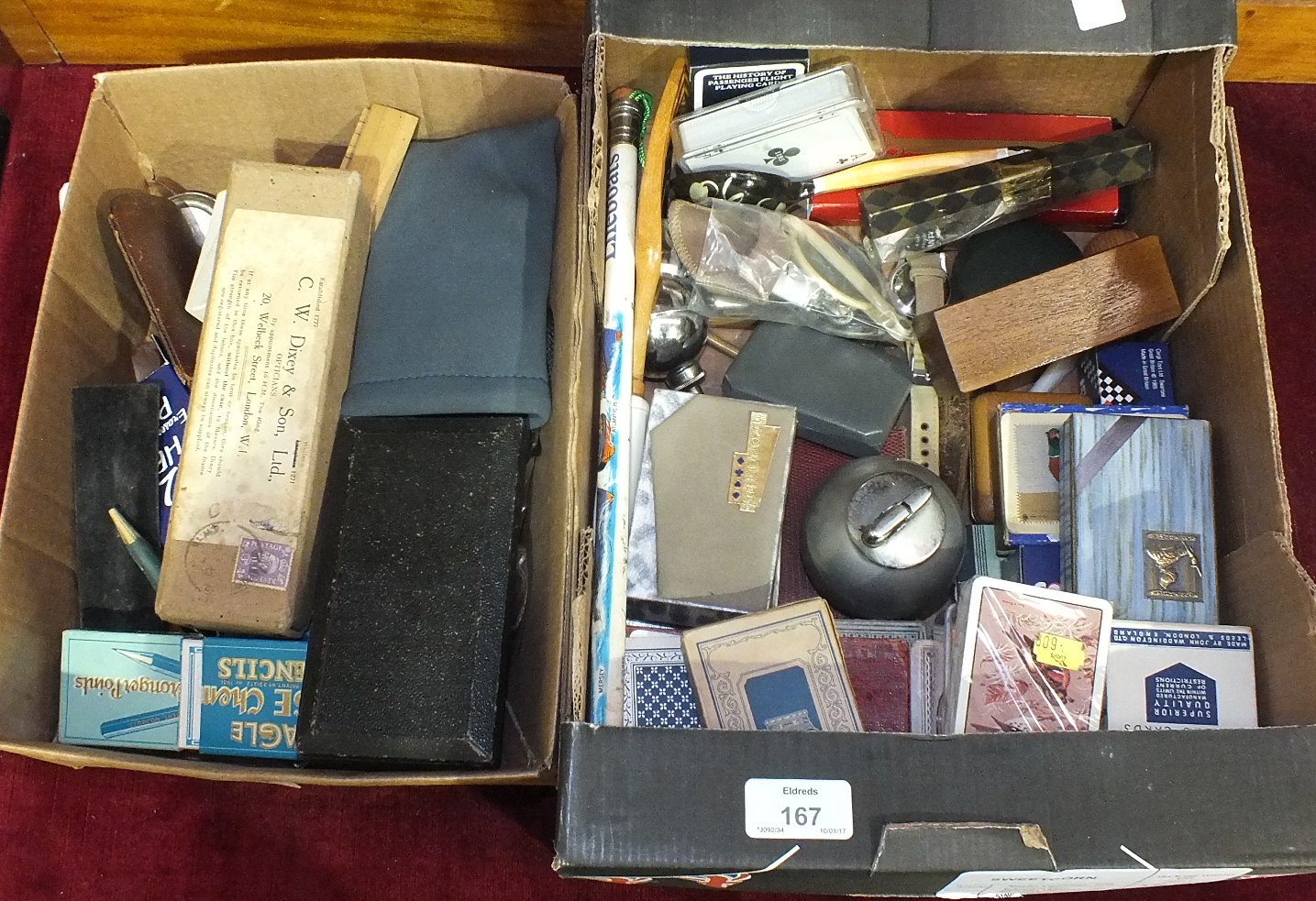 A collection of various packs of playing cards, pencils, cigarette lighters and miscellaneous