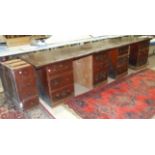 An office shop counter fitting, comprising a stained pine panelled front and a mahogany shop counter