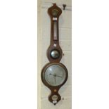 A mahogany wheel barometer, the level dial signed 'J Reynolds, St Austell', 96cm.