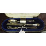 A silver four-piece christening set, comprising: spoon, fork, napkin ring, (all marked 'Eric') and