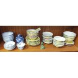 A collection of modern Oriental ceramics, including rice bowls, a small blue and white ginger jar