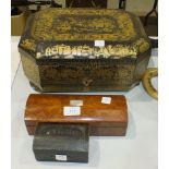 A Victorian octagonal lacquered work box having overall chinoiserie decoration, (a/f, faded), with