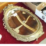 A small gilt metal-framed concave mirror, 45 x 30cm, plated cutlery, glass lustre drops and other