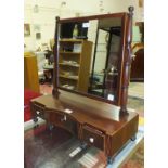 A 19th century mahogany toilet mirror, the rectangular mirror plate above a rectangular base, with