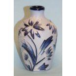 A small Moorcroft vase with tubeline 'blue on blue' floral decoration, 9.5cm high, impressed blue