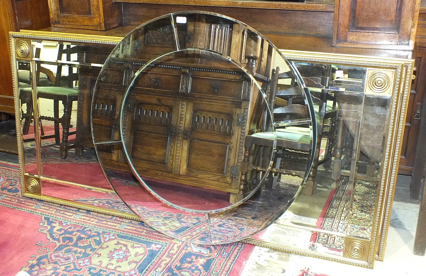 A pair of modern gilt-framed bevelled rectangular wall mirrors, 177 x 86cm and a circular mirror, (