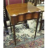 A mahogany shaped side table fitted with a serpentine drawer, on turned legs with castors, 57cm