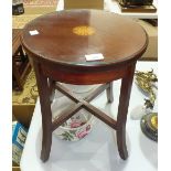 An Edwardian low mahogany circular-top occasional table with inlaid central shell motif, 35cm