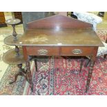 An Edwardian stained wood rectangular hall table fitted with two frieze drawers, on turned legs,